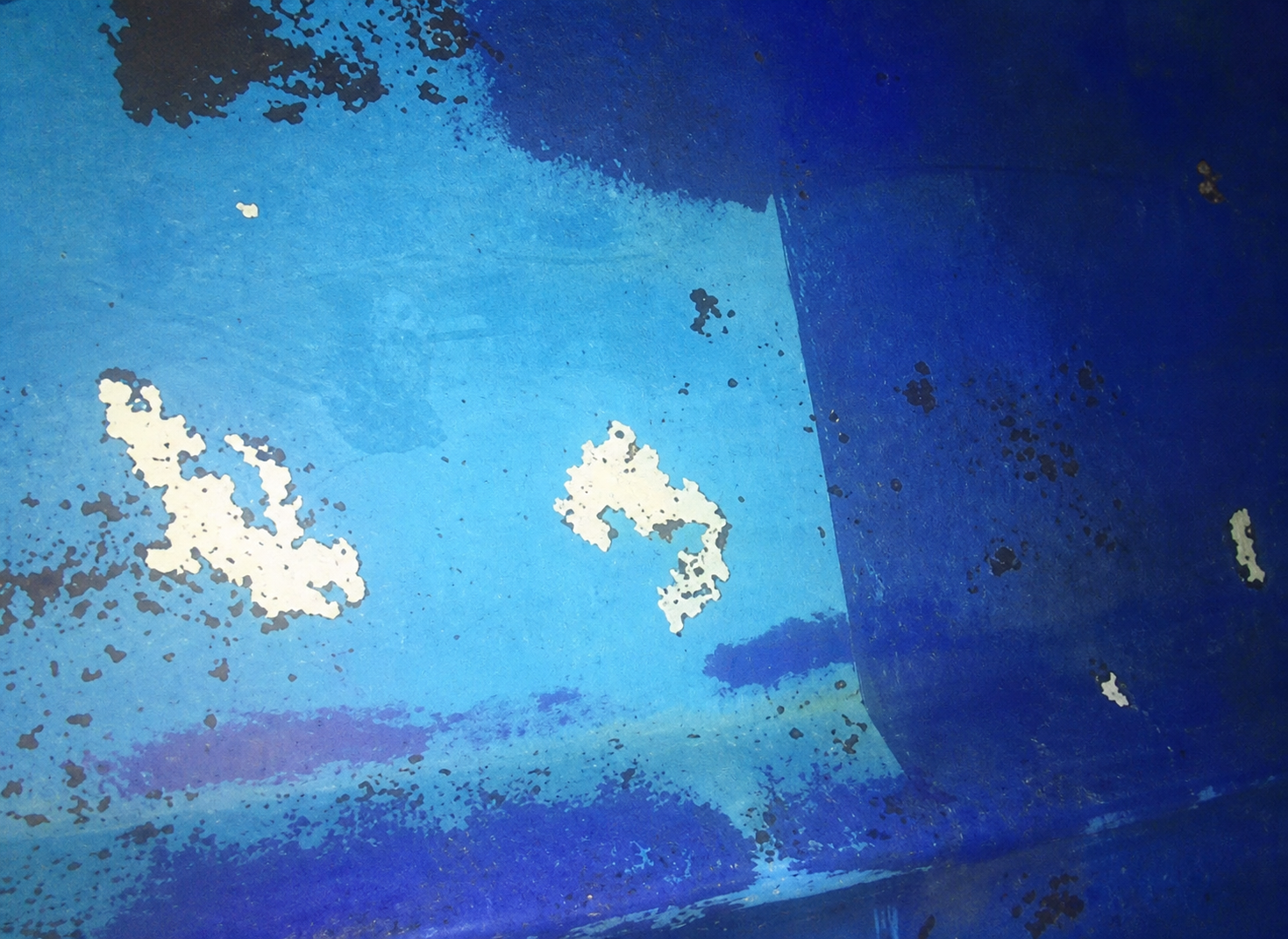 Light-blue untreated original coating with visible abrasion after one year in the North Sea